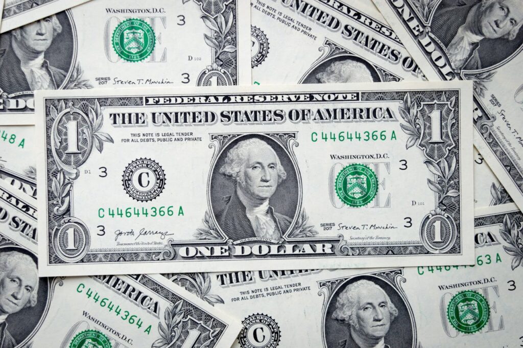 A closeup view of several stacked US dollar bills showcasing currency and financial concepts.